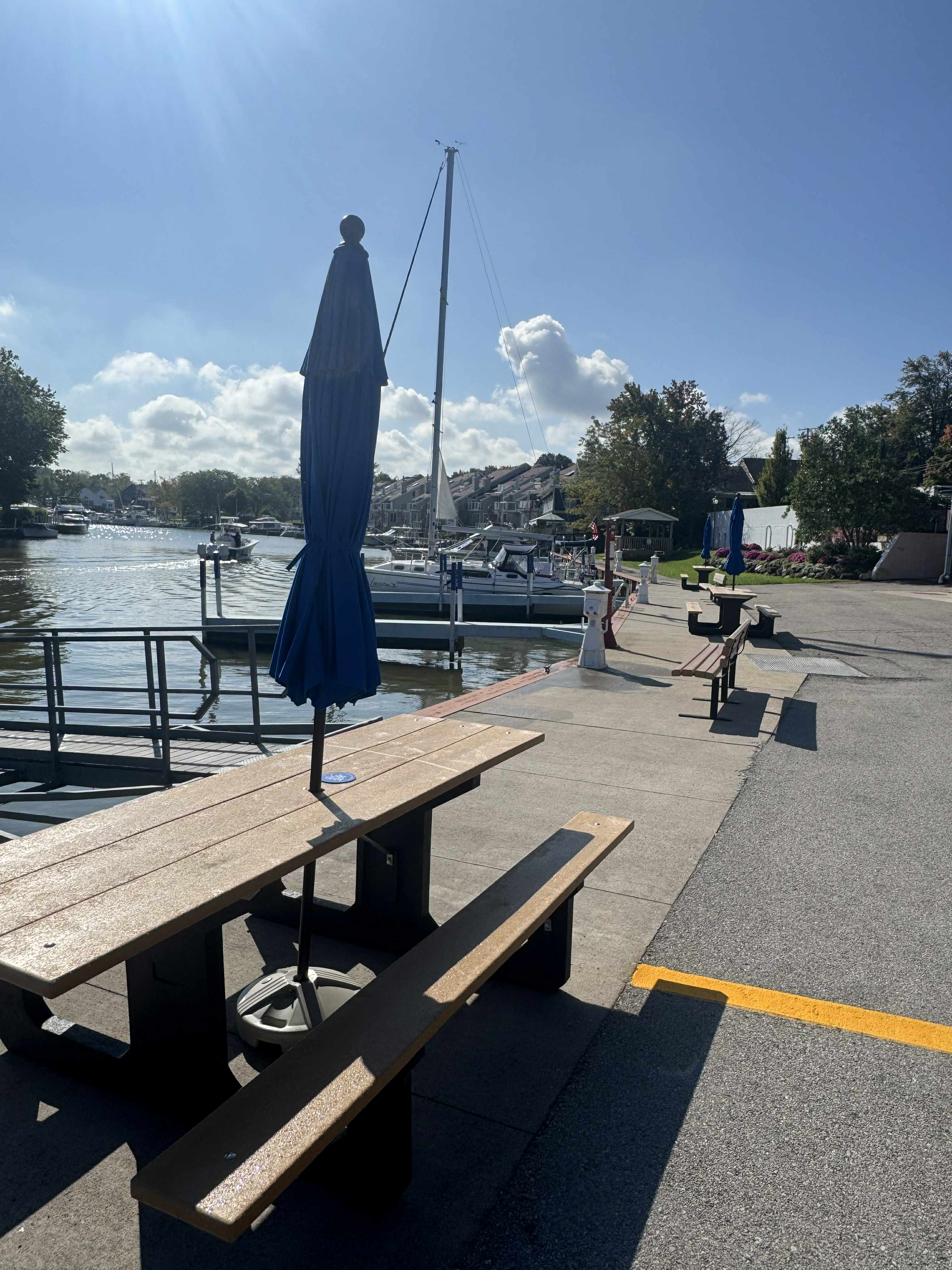 picnic tables on the side of a river